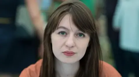 The acclaimed novelist claims she cannot visit the UK due to legal concerns